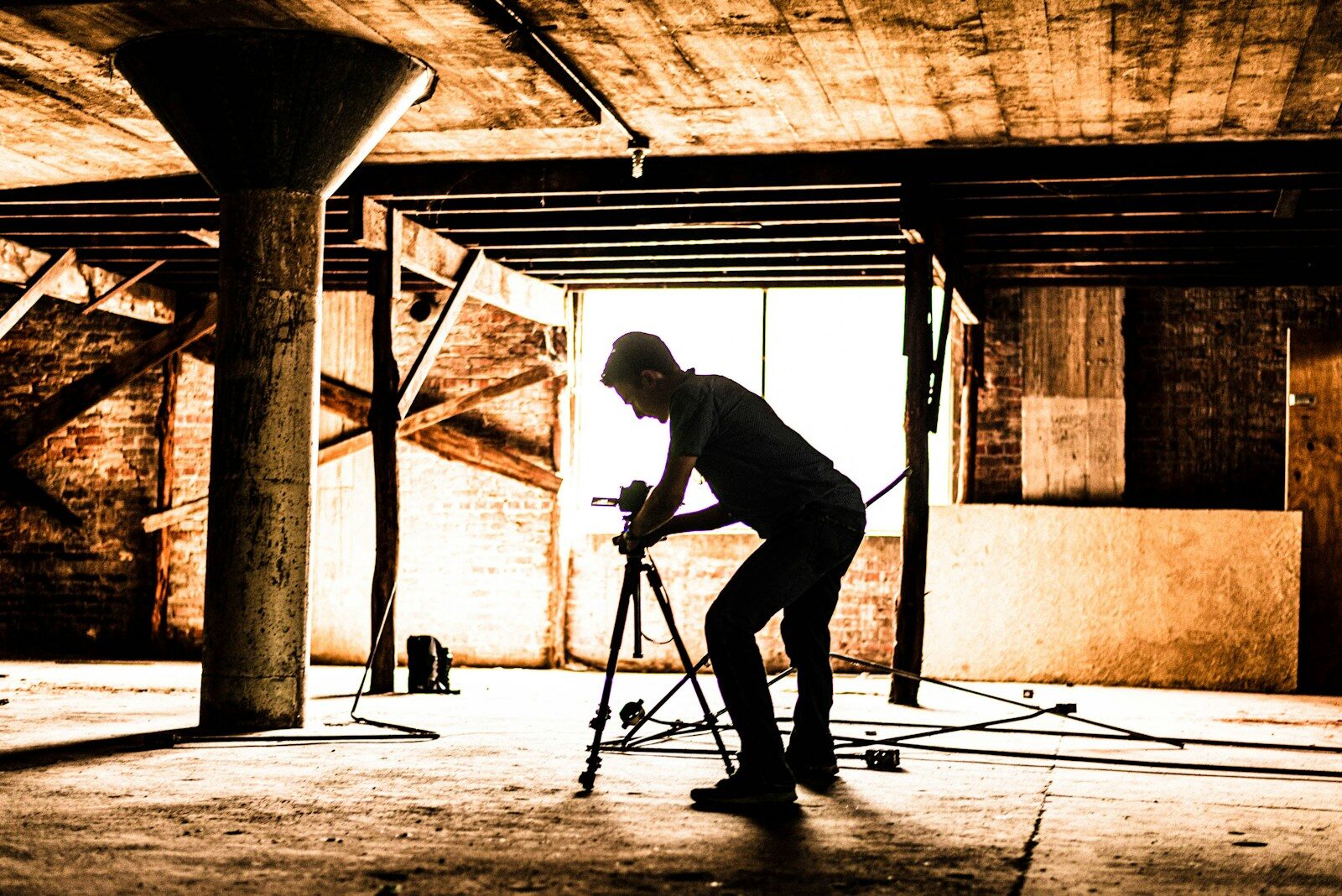 silhouette of man inside building